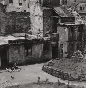 Lot 4332, Auction  112, Steinert, Otto, Woman feeding chickens in ruins in Saarbrücken