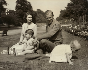 Lot 4140, Auction  120, Elizabeth II, Queen, Princess Elizabeth and the Duke of Edinburgh with their two children, Prince Charles and Princess Anne, in the garden at Clarence House, London